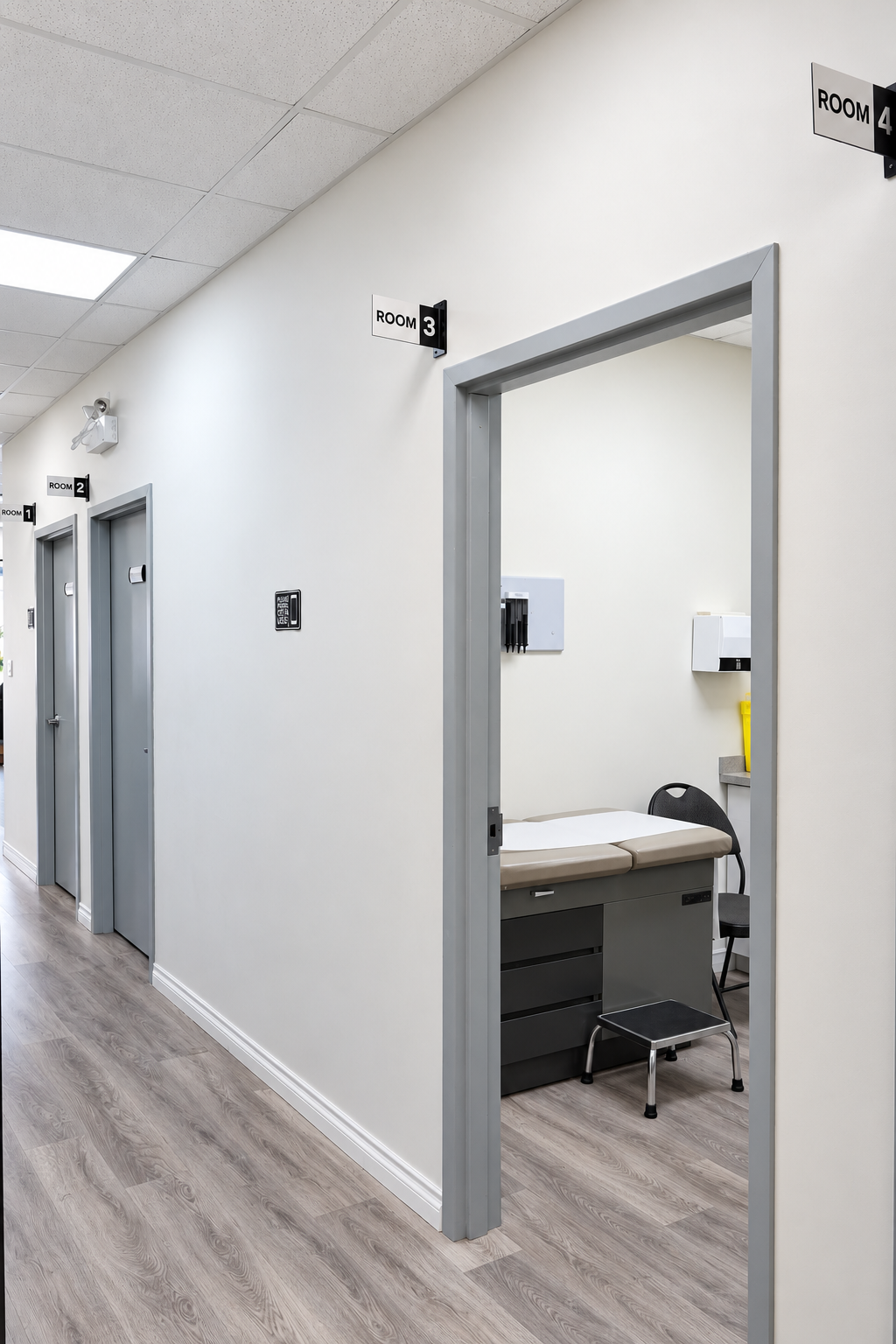 Clinic hallway with numbered exam rooms